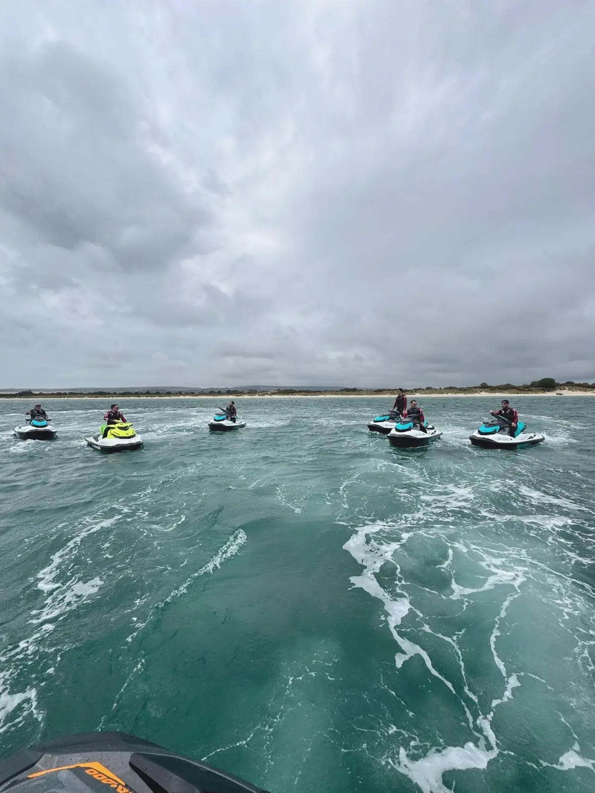 Full team riding out across Studland Bay
