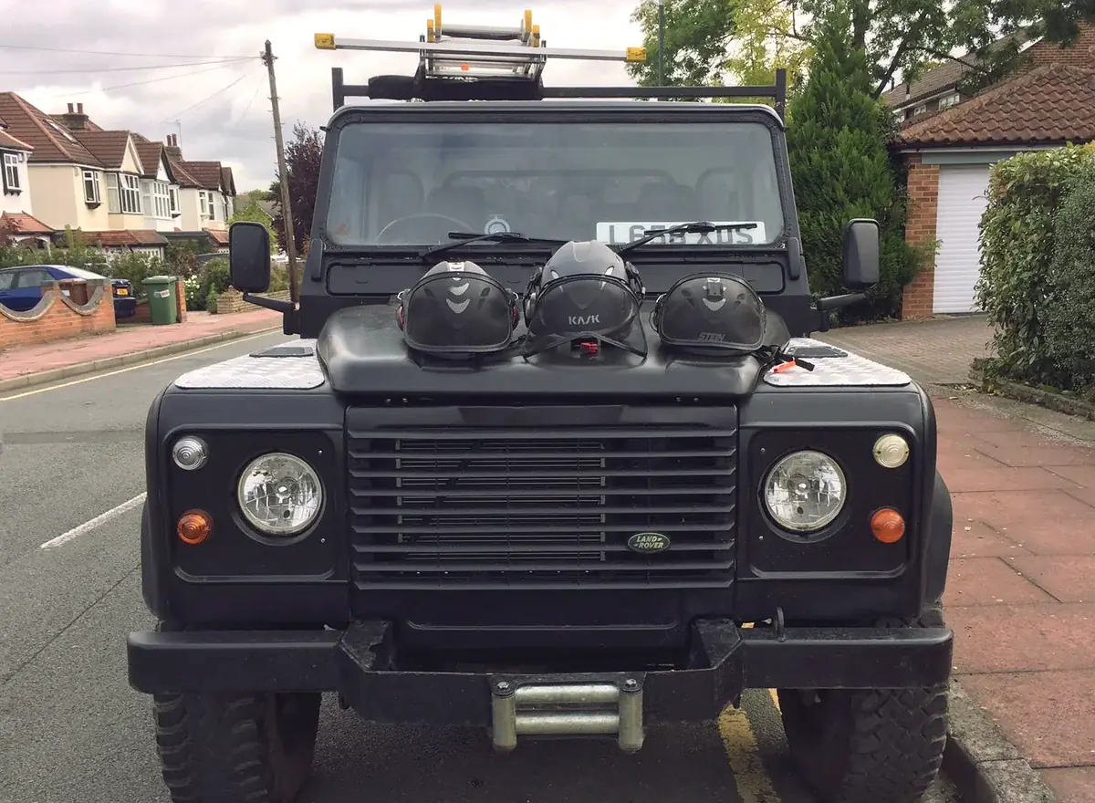 Our Defender with helmets on the bonnet
