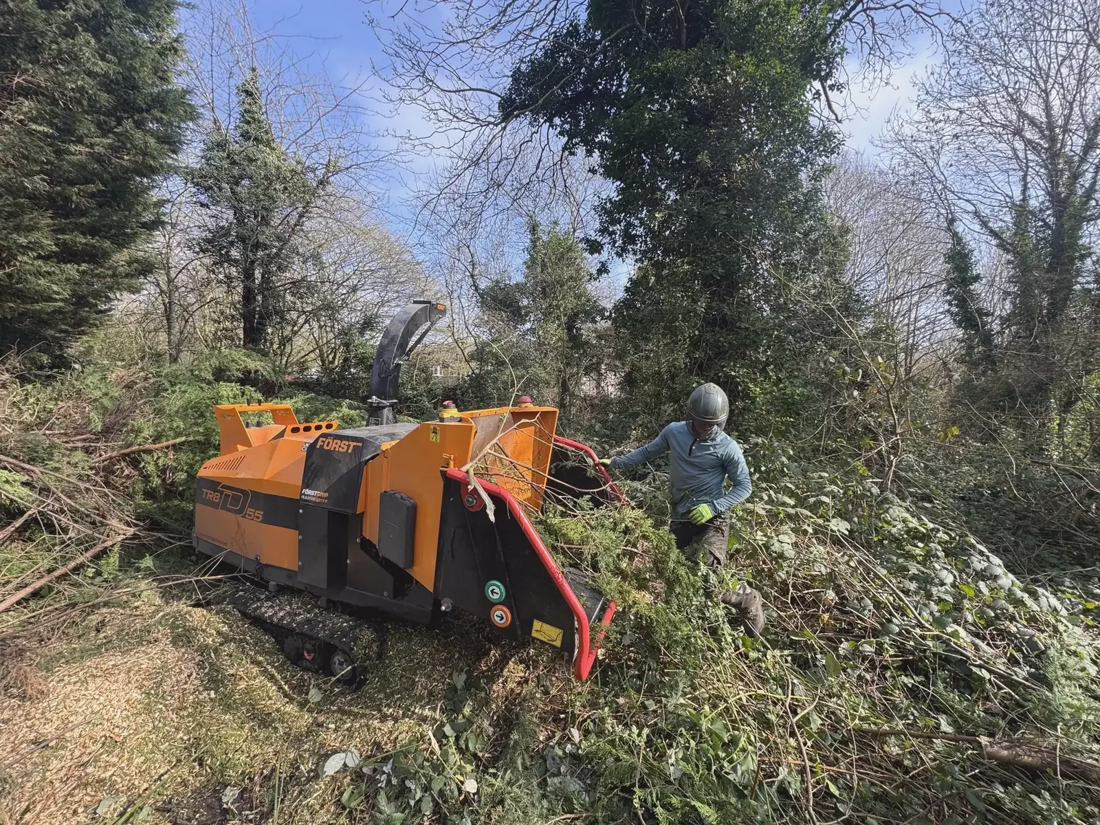 Forst chipper working through brash on a clearance site